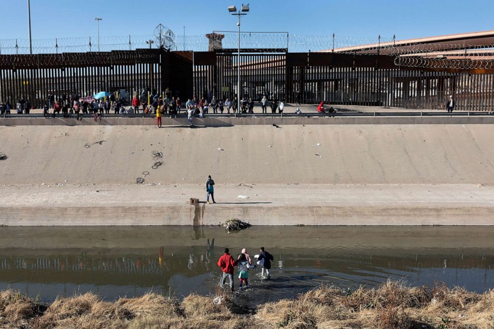 PHOTO: migrants cross the Rio Grande from Ciudad Juarez, Mexico, to El Paso, Texas on January 08, 2023.