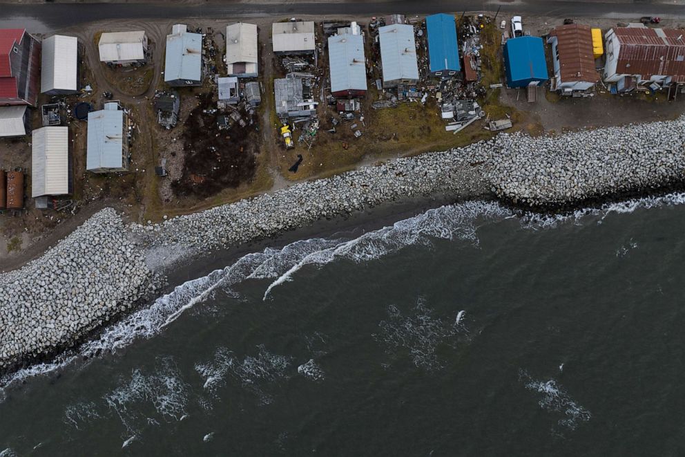 PHOTO: Small waves crash into reinforced seawalls in Shishmaref, Alaska, Oct. 4, 2022. Rising sea levels, flooding, increased erosion and loss of protective sea ice and land have led residents of this island community to vote twice to relocate.