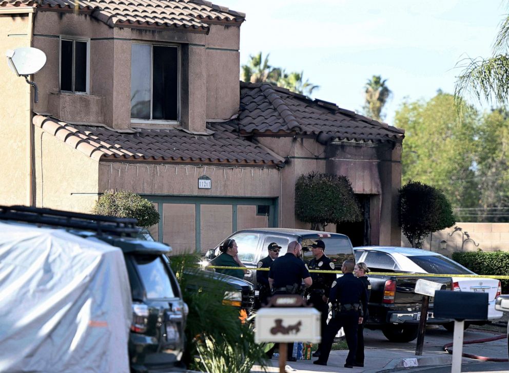 PHOTO: Firefighters and Riverside Police gather outside a burned home in Riverside, Calif., on Nov. 25, 2022, following a house fire. Three bodies were found in the house which police are investigating as a homicide.