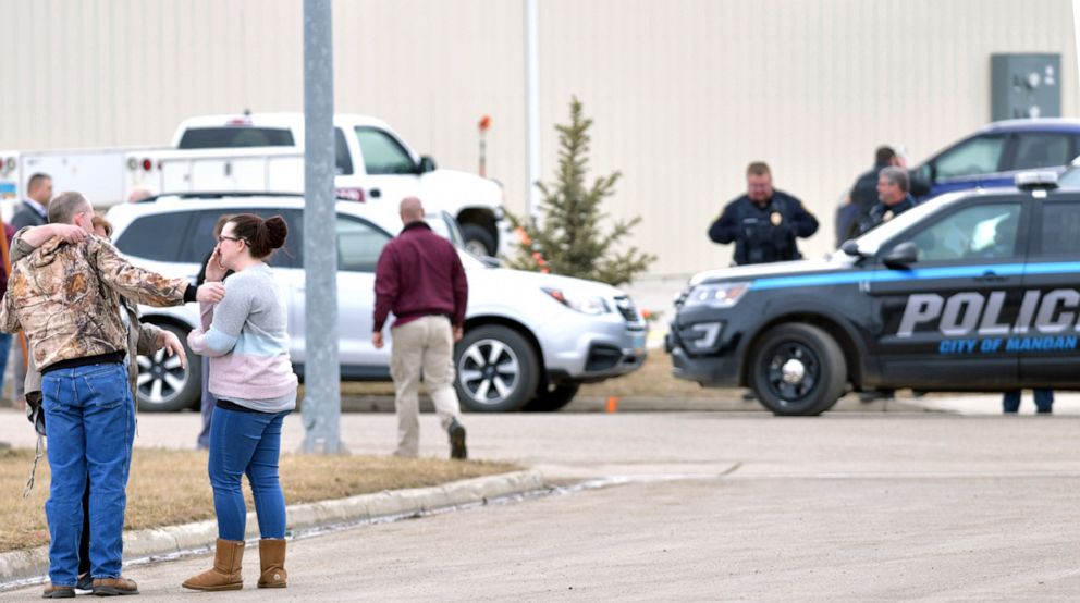 Family and friends are consoling themselves at the site near the south side of the RJR Maintenance and Management building in Mandan, ND on April 1, 2019.