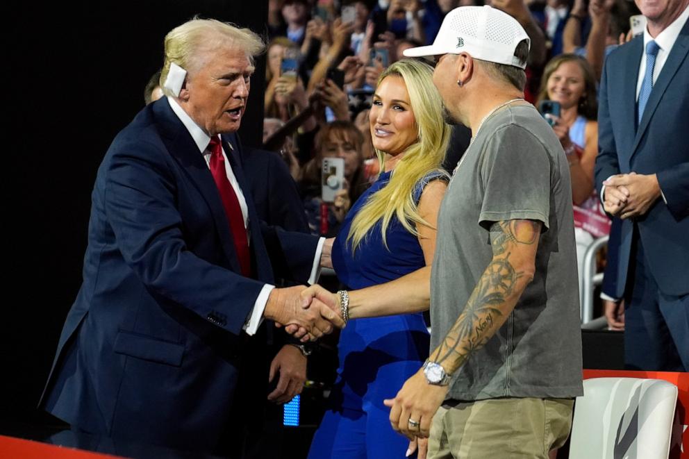PHOTO: Republican presidential candidate former President Donald Trump greets country music singer Jason Aldean as he arrives for the final day of the Republican National Convention, July 18, 2024, in Milwaukee.