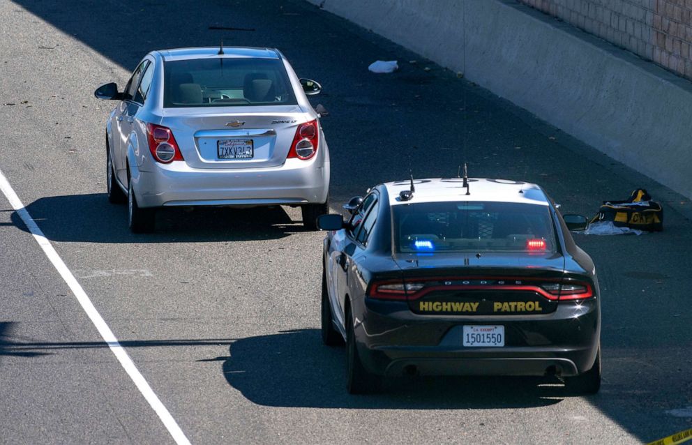 PHOTO: A Chevrolet Sonic sits on the shoulder of the northbound 55 freeway north of Chapman Avenue following a shooting Friday, May 21, 2021 in Orange, Calif.