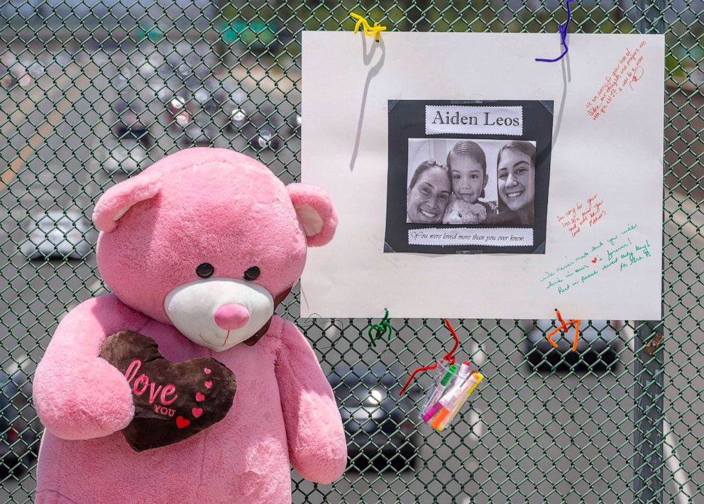 PHOTO: A large stuffed toy bear and a poster board with a photo and notes are part of a memorial on the E. Walnut Avenue overpass of the 55 freeway in Orange, Calif., May 22, 2021.