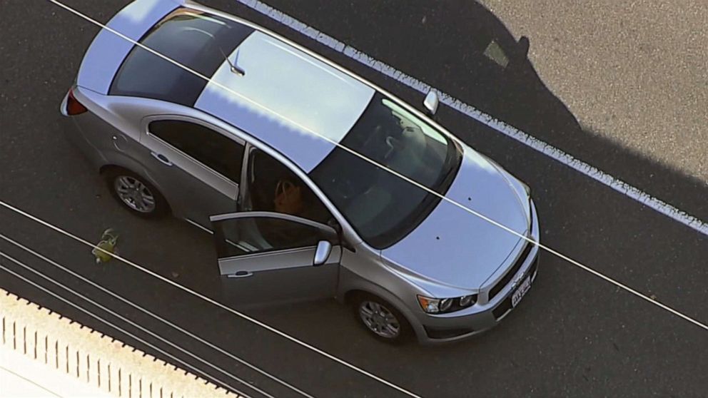 PHOTO: Investigators gather near a car where, according to authorities, a 6-year-old boy was fatally shot in a road rage incident on the 55 Freeway in Orange, Calif., May 21, 2021.