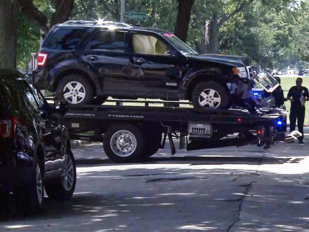 PHOTO: Police tow away a black Ford SUV they say was driving by a suspect in an apparent road-rage shooting on July 13, 2019, in Milwaukee that left 3-year-old Brooklyn Harris dead.