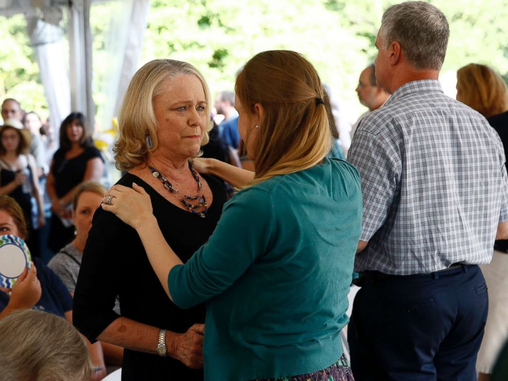 PHOTO: Judy Hiaasen, left, sister of Rob Hiaasen, one of the journalists killed in the shooting at The Capital Gazette newspaper offices, speaks with a mourner during a memorial service, July 2, 2018, in Owings Mills, Md.