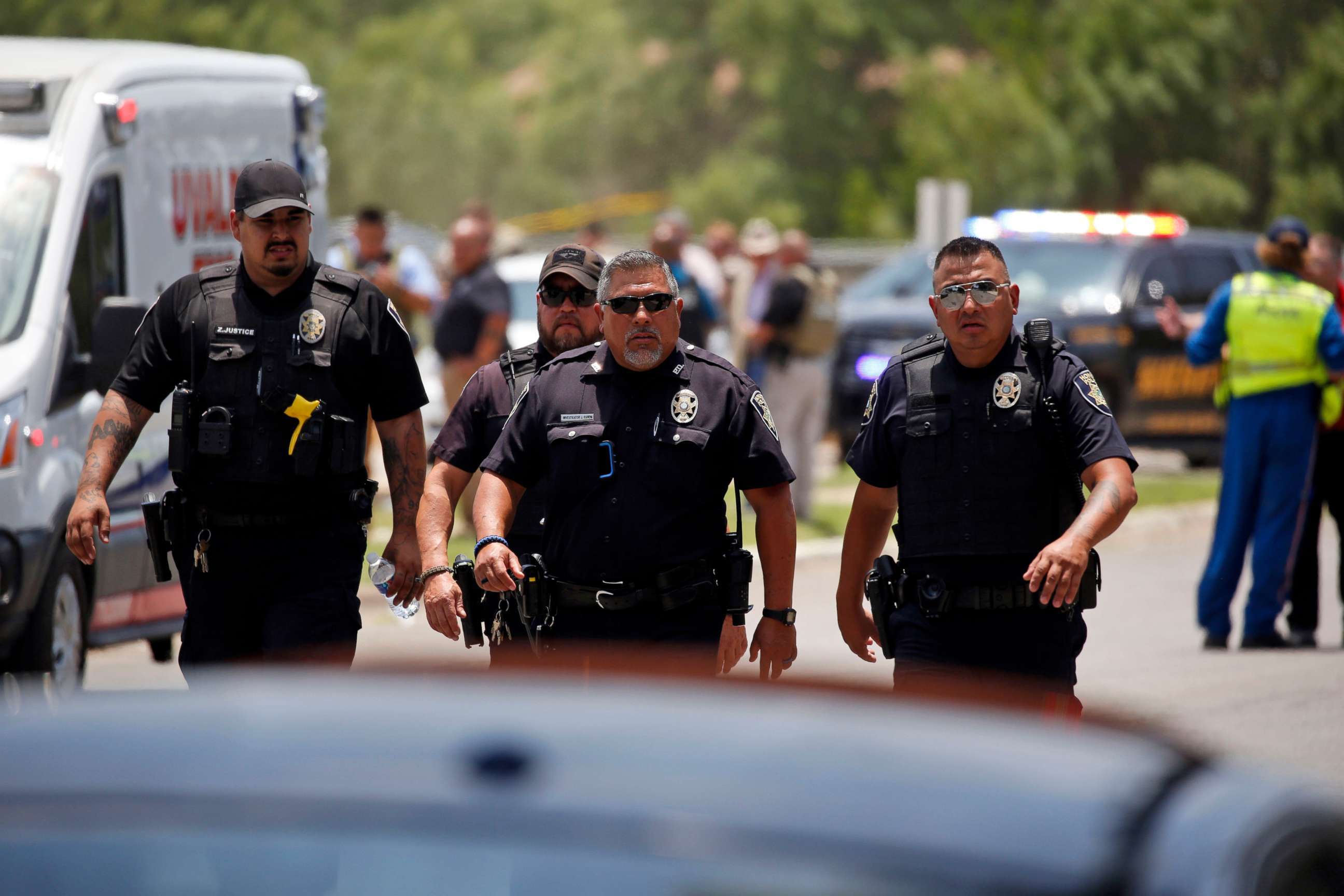PHOTO: Police walk near Robb Elementary School following a shooting, May 24, 2022, in Uvalde, Texas.