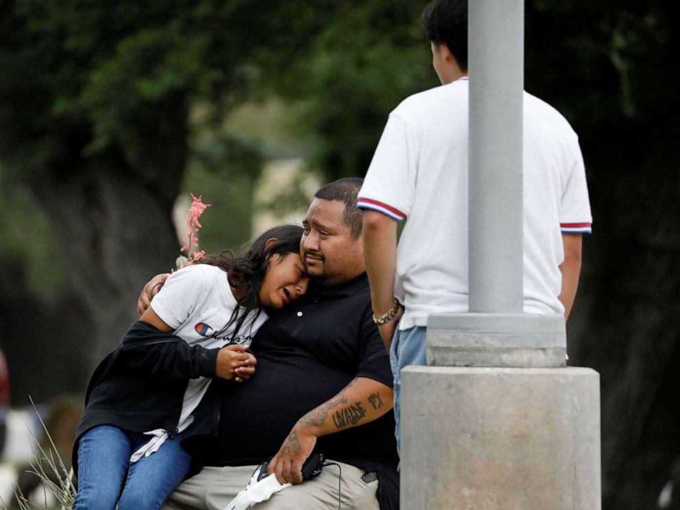 PHOTO: People react outside the Staff Sgt Willie de Leon Civic Center, where students had been transported from Robb Elementary School after a shooting, in Uvalde, Texas, May 24, 2022.