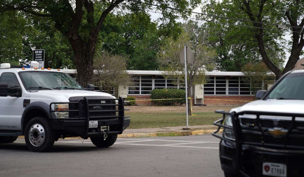 PHOTO: State trooper and law enforcment vehicules are seen outside of Robb Elementary School in Uvalde, Texas, May 24, 2022.