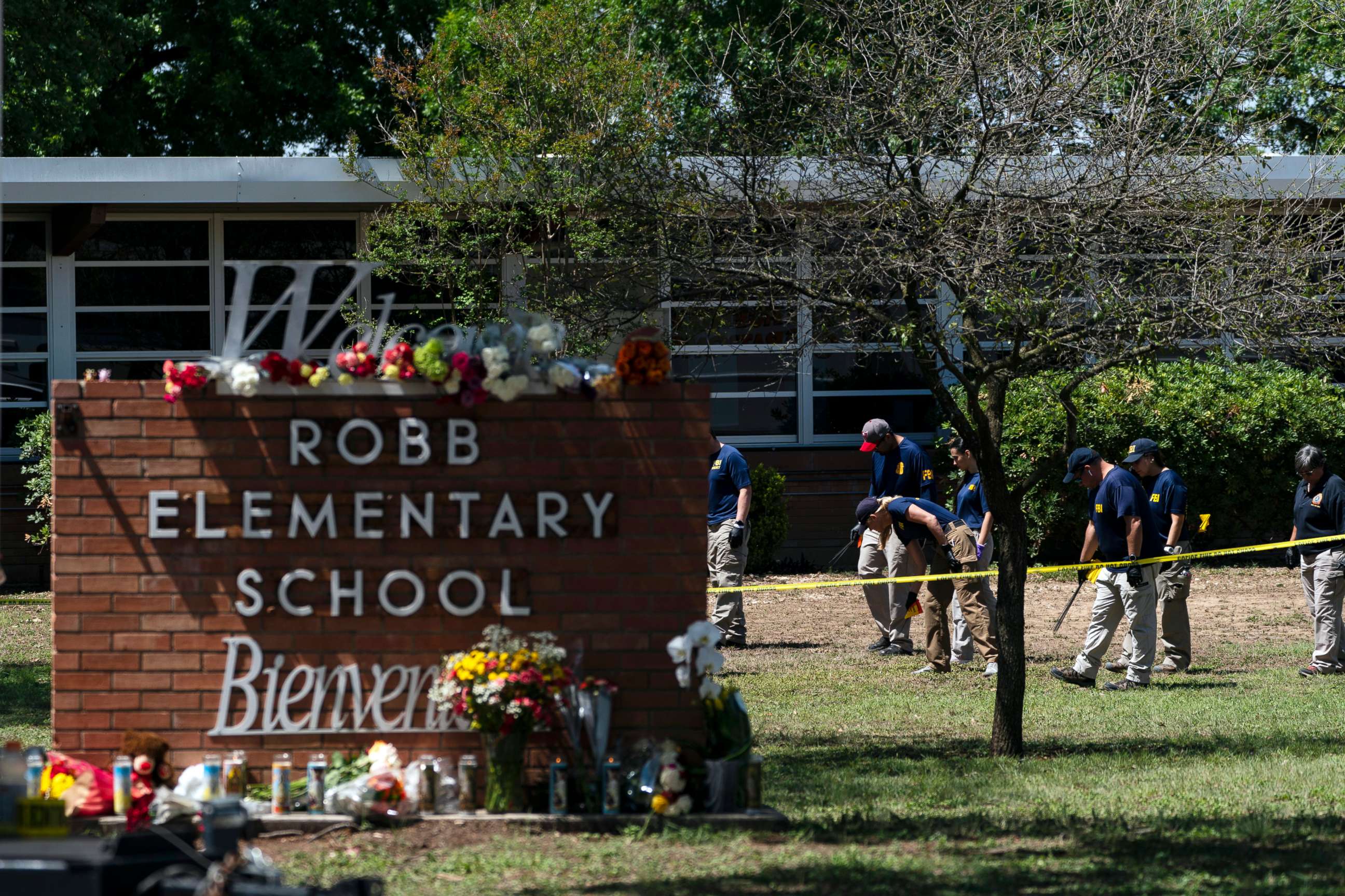 PHOTO: Investigators search for evidences outside Robb Elementary School in Uvalde, Texas, on May 25, 2022, one day after an 18-year-old gunman killed 19 students and two teachers.