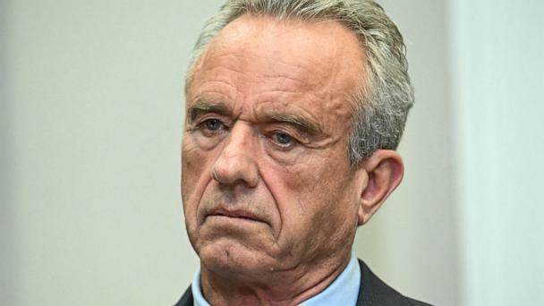 Secretary of Health and Human Services Robert F. Kennedy Jr. listens as President Donald Trump speaks during a news conference about prescription drug prices at the White House on May 12, 2025, in Washington.