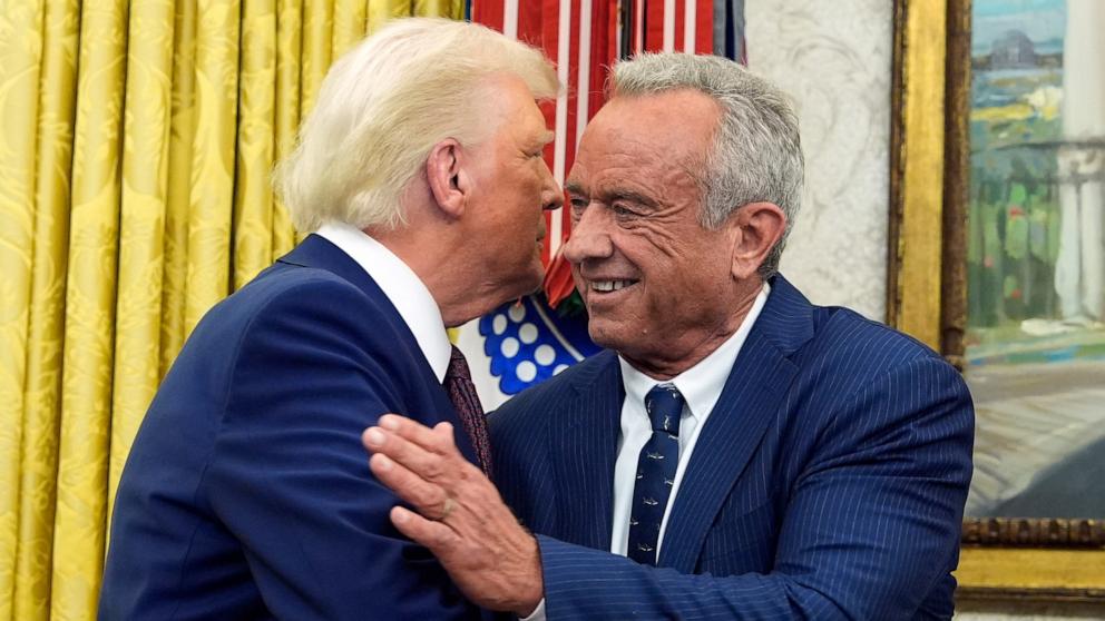 PHOTO: President Donald Trump congratulates Robert F. Kennedy Jr., after he was sworn in as Health and Human Services Secretary in the Oval Office at the White House, Feb. 13, 2025, in Washington. 
