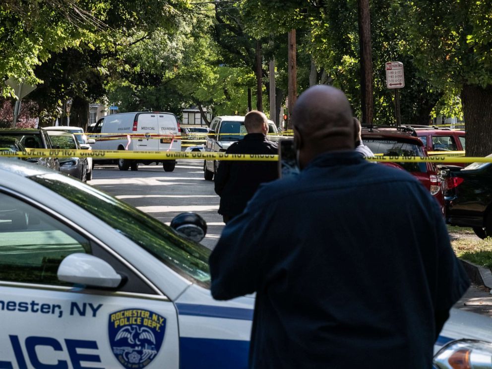 PHOTO: Police officers investigate a crime scene after a shooting at a backyard party on Sept. 19, 2020, in Rochester, N.Y.