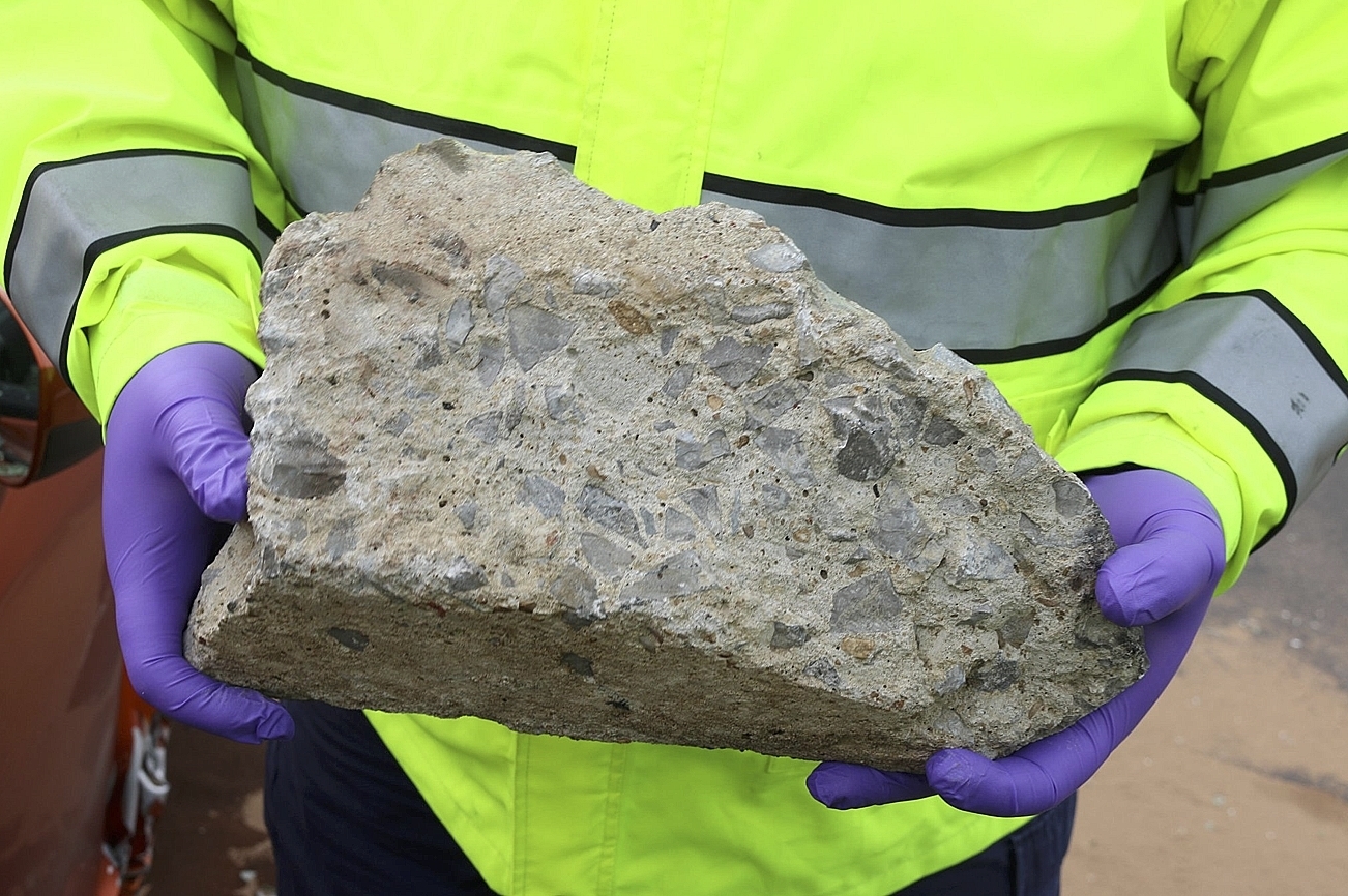 PHOTO: In this photo released by the Nashville Police, an officer holds large piece of concrete that struck a vehicle on Interstate 24, Tuesday, Nov. 20, 2018, in Nashville, Tenn.