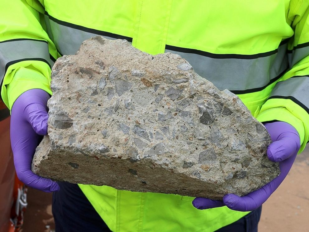 PHOTO: In this photo released by the Nashville Police, an officer holds large piece of concrete that struck a vehicle on Interstate 24, Tuesday, Nov. 20, 2018, in Nashville, Tenn.
