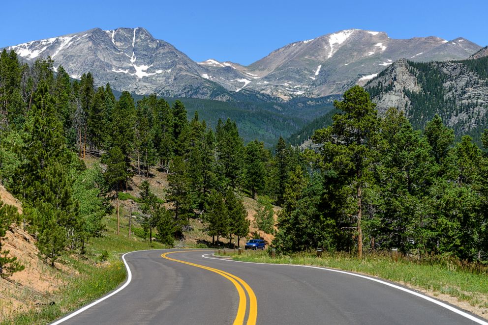 PHOTO: A summer view of winding Fall River Road (Highway 34), with Ypsilon Mountain and Fairchild Mountain of Mummy Range towering in background, Rocky Mountain National Park, Colo.