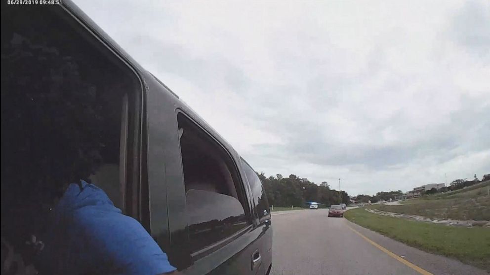 PHOTO: In this undated screen grab of body-cam footage, an officer is shown being dragged during a traffic stop.