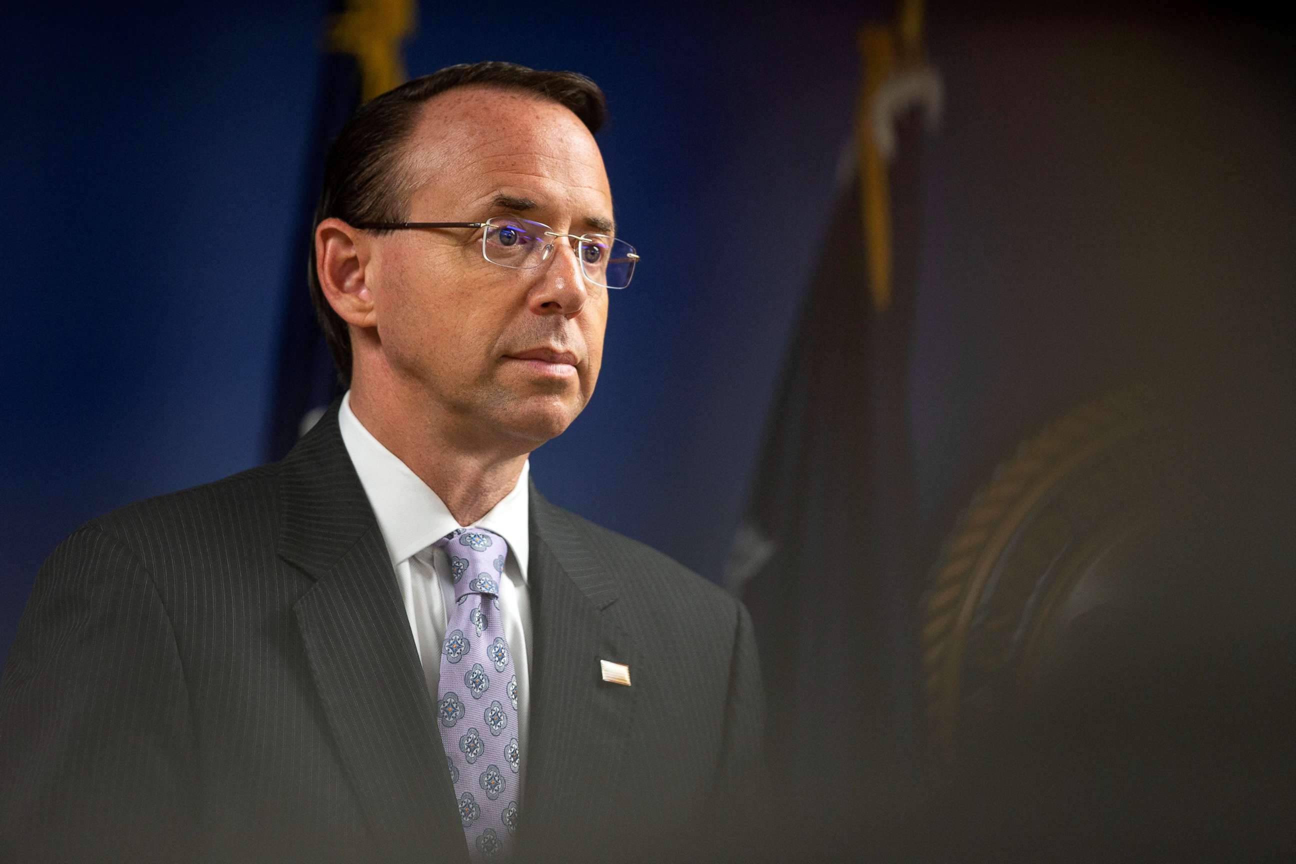 PHOTO: Deputy Attorney General Rod Rosenstein listens as U.S. Attorney General Jeff Sessions speaks during a news conference to announce efforts to reduce transnational crime, at the U.S. District Attorney's office, in Washington D.C., Oct. 15, 2018.