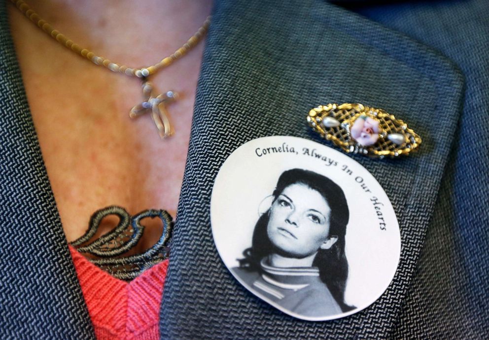 PHOTO: A woman wears a sticker honoring Cornelia Crilley before a news conference regarding the sentencing of convicted California serial killer Rodney Alcala in the murder of Crilley and Ellen Hover, in New York, Jan. 7, 2013.