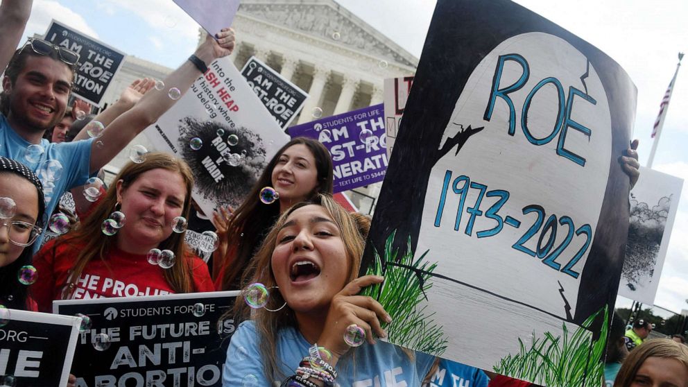 Anti-abortion campaigners celebrate outside the Supreme Court, June 24, 2022. The conservative-dominated court overturned the landmark 1973 "Roe v Wade" decision that enshrined a woman's right to an abortion and said individual states can permit or restrict the procedure themselves.