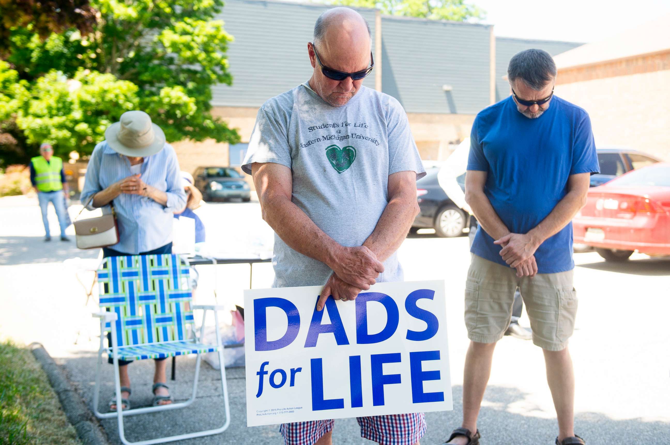 PHOTO: Rick Rainville bows his head in prayer at a rally of abortion opponents organized by Sidewalk Advocates for Life outside the Power Family Health Center Planned Parenthood  in Ann Arbor, Mich., June 24, 2022. 