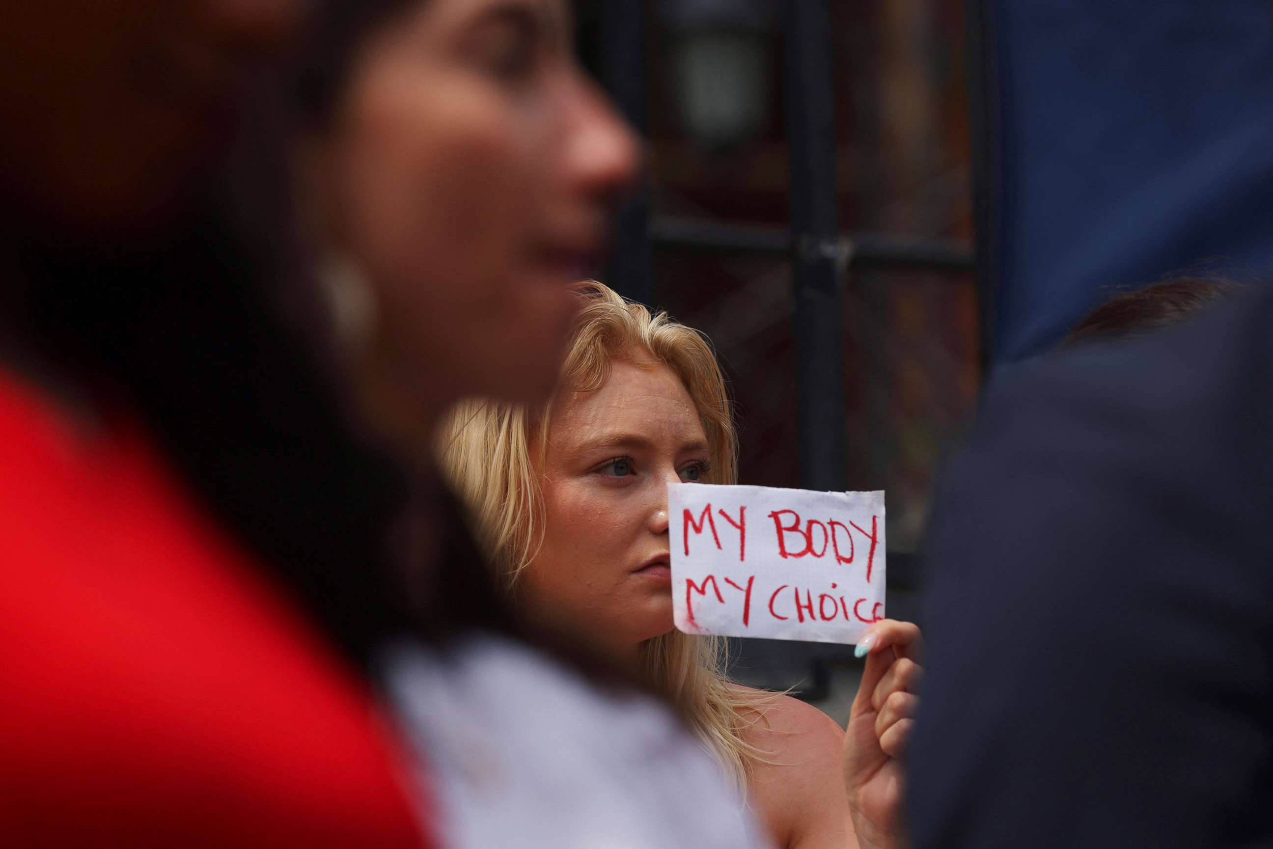 PHOTO: An abortion rights demonstrator holds a sign after the United States Supreme Court ruled in the Dobbs v. Women's Health Organization abortion case, overturning the landmark Roe v Wade abortion decision, in Boston, June 24, 2022.   