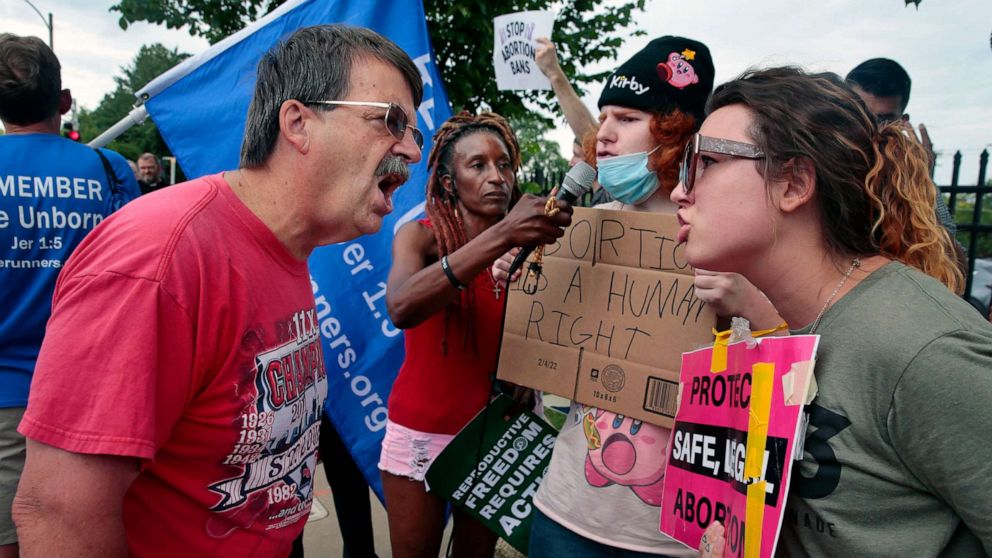 PHOTO: Steve Sallwasser of Arnold debates Brittany Nickens of Maplewood during competing rallies held outside Planned Parenthood of Missouri following the Supreme Court announcement overturning Roe v Wade abortion protection, June 24, 2022, in St. Louis. 
