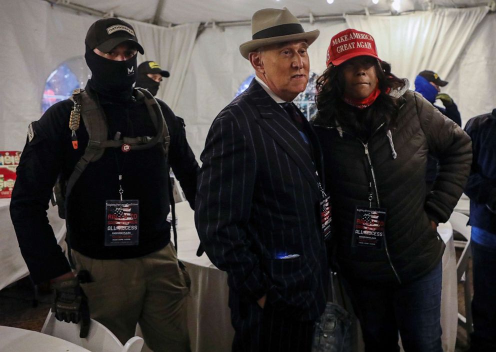 PHOTO: Members of the Oath Keepers provide security to Roger Stone at a rally the night before groups attacked the U.S. Capitol, in Washington, D.C., Jan. 5, 2021.