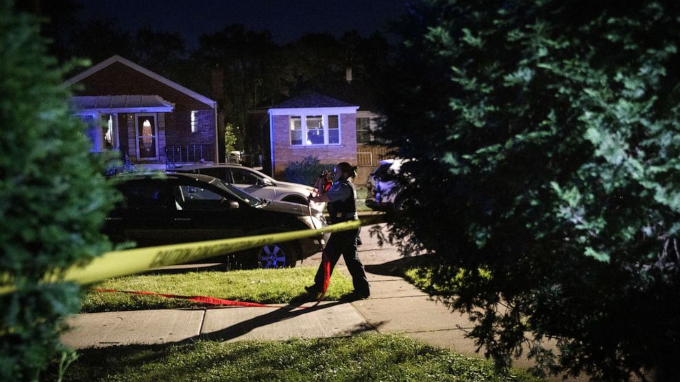 PHOTO: Police work at the scene where a person was fatally shot, June 21, 2020, in the 6200 block of North Troy Street in the West Rogers Park neighborhood in Chicago.