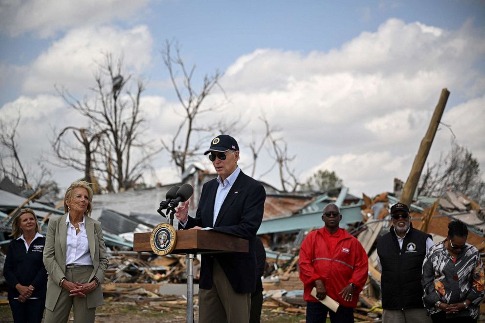 PHOTO: In this March 31, 2023, file photo, President Joe Biden speaks in Rolling Fork, Mississippi, as First Lady Jill Biden (2nd L) and Federal Emergency Management Agency (FEMA) Deanne Criswell (L) look on.