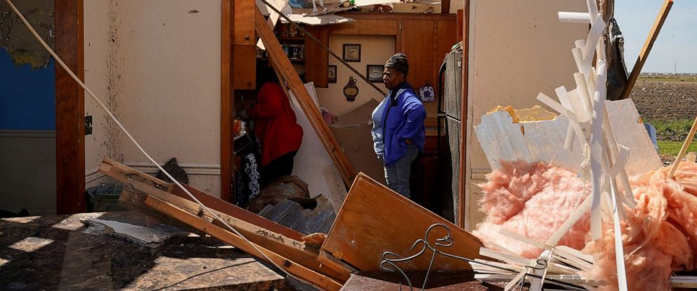 PHOTO: Chandra Wells, 47, and her sister Jennifer, 57, salvage items from the wreckage of Chandras home after thunderstorms spawning high straight-line winds and tornadoes ripped across the state, in Rolling Fork, Miss., March 27, 2023.