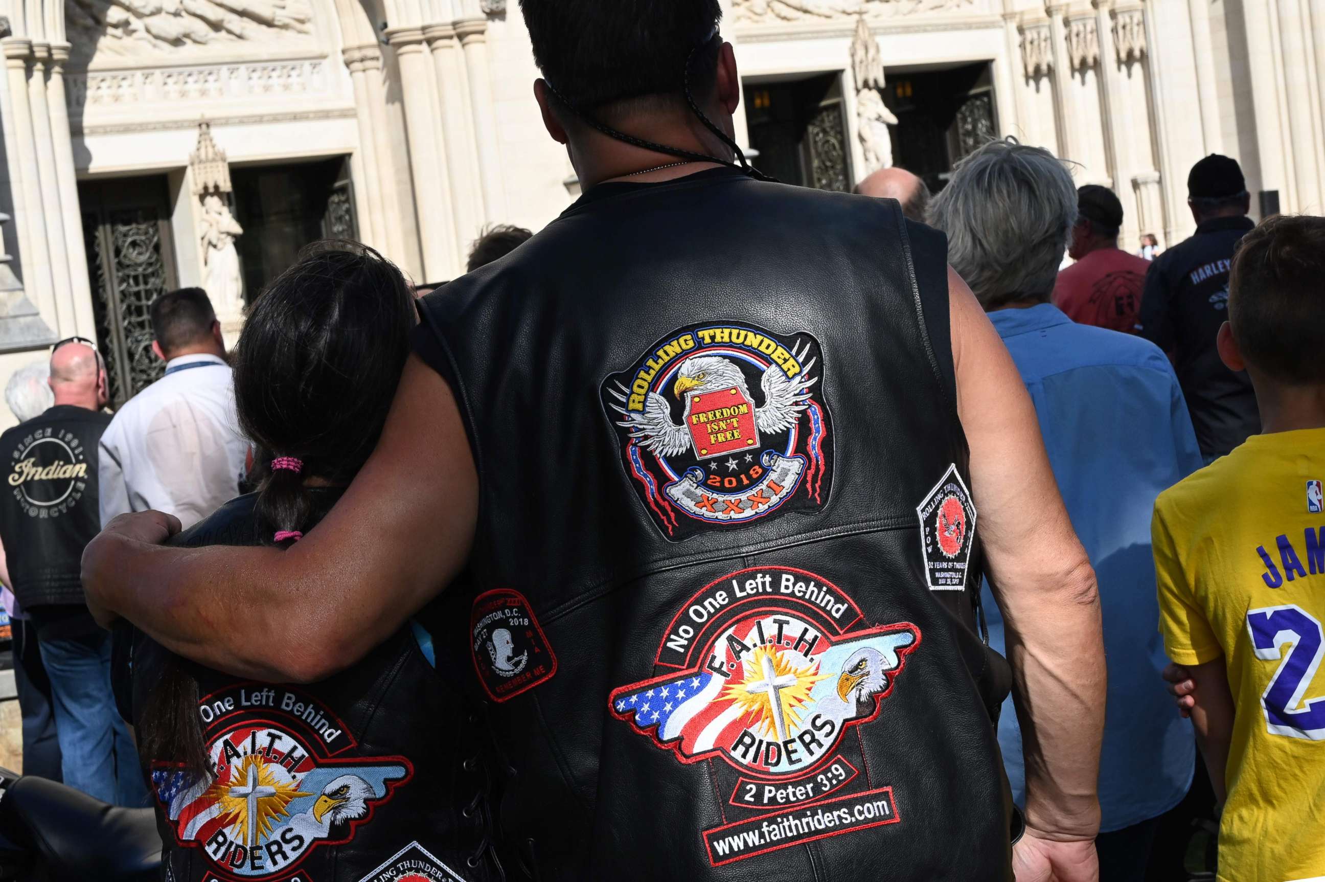 PHOTO: Motorcyclists are watching Clergyman Rev. Andrew K. Barnett perform the "Blessing of the Bikes" at the Washington National Cathedral, May 24, 2019, in Washington, D.C. 