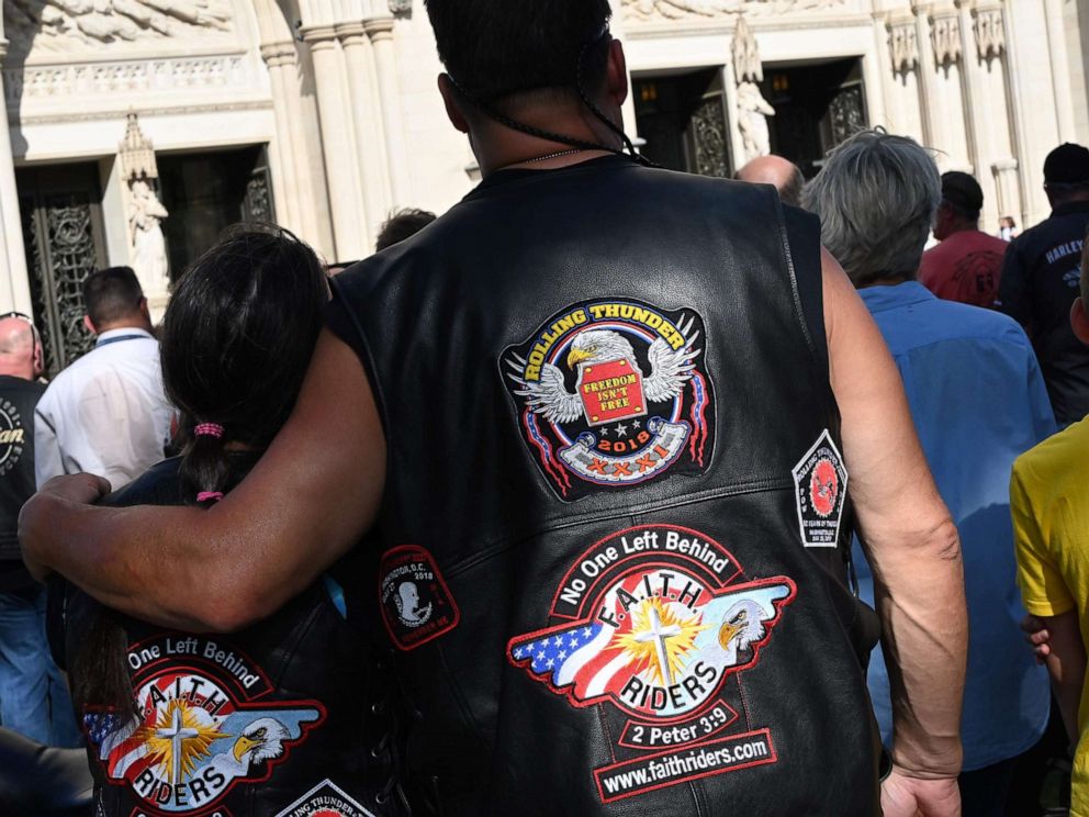 PHOTO: Motorcyclists are watching Clergyman Rev. Andrew K. Barnett perform the Blessing of the Bikes at the Washington National Cathedral, May 24, 2019, in Washington, D.C.