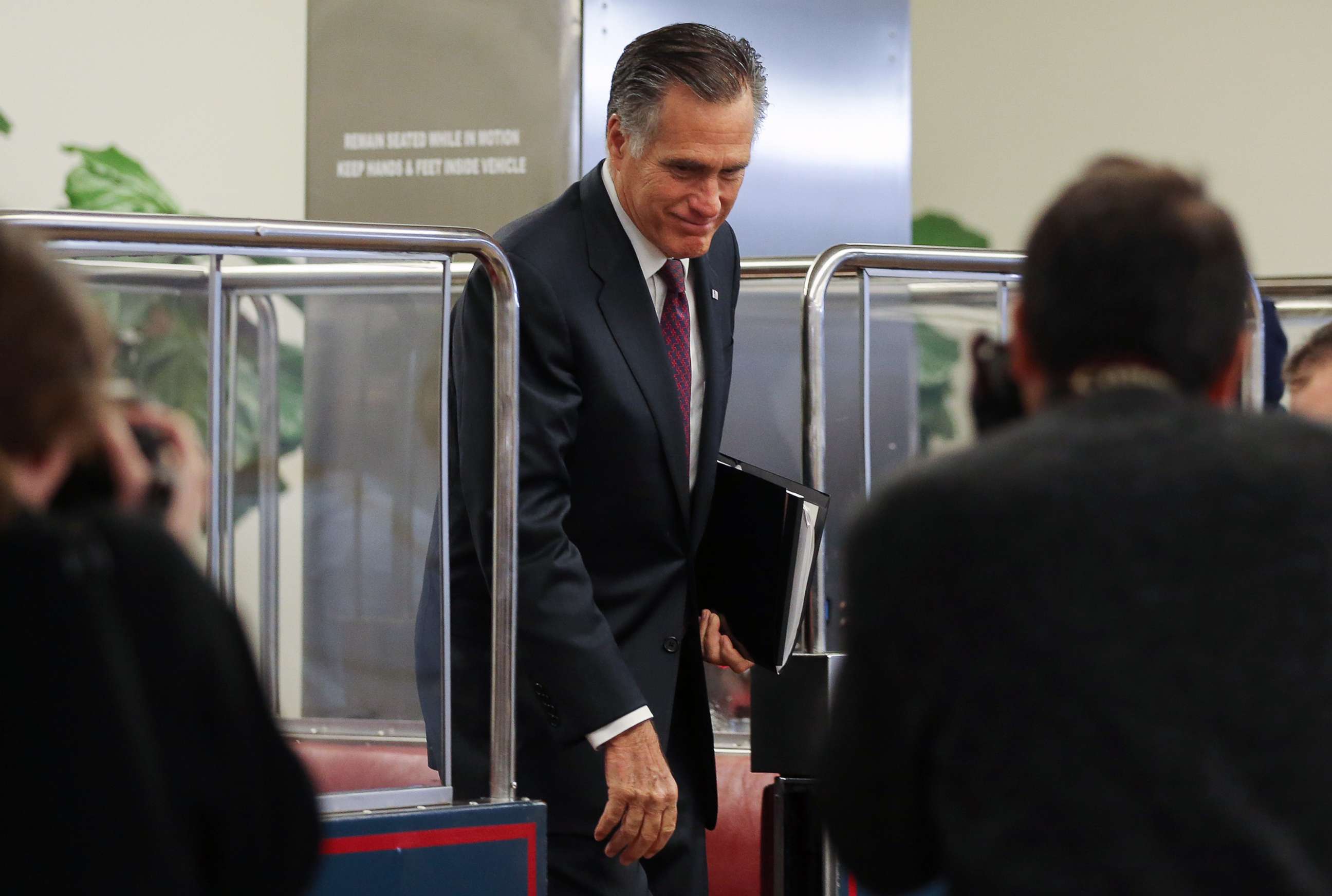 PHOTO: Sen. Mitt Romney departs the Senate subway upon arrival to the Capitol for the Senate impeachment trial on Jan, 28, 2020 in Washington, D.C.