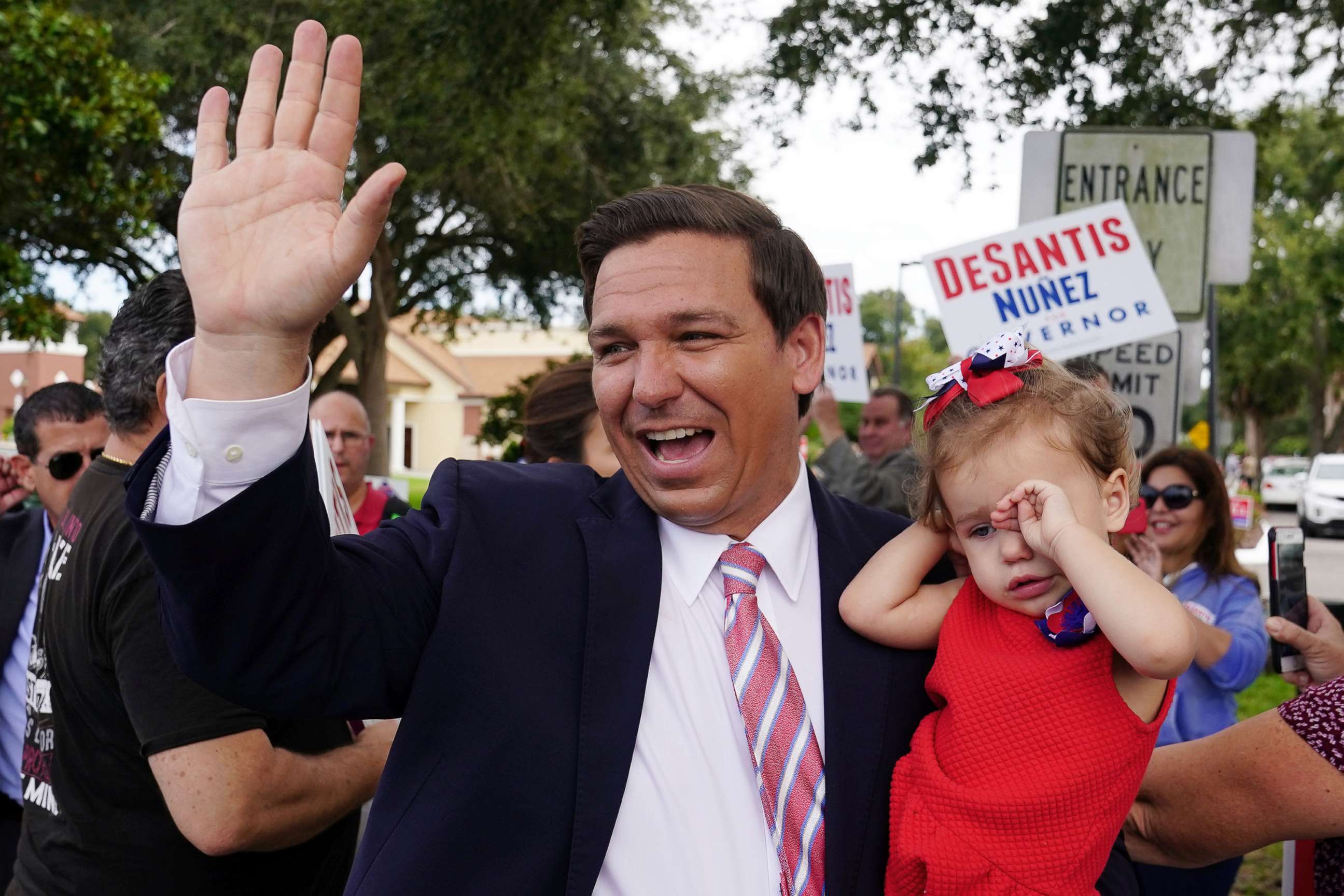 PHOTO: Republican candidate for Governor Ron DeSantis arrives to vote, carrying his daughter Madison, in Ponte Vedra Beach, Fla., Nov. 6, 2018.