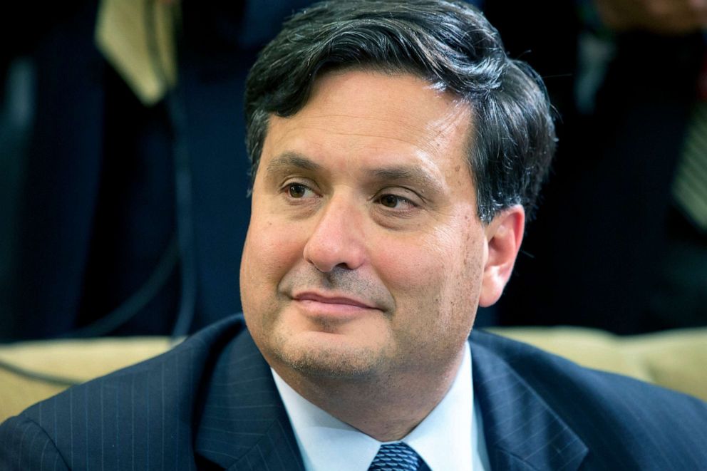 PHOTO: In this Wednesday, Oct. 22, 2014 file photo, Ebola coordinator Ron Klain listens as President Barack Obama speaks to the media about the government's Ebola response in the Oval Office of the White House in Washington. 