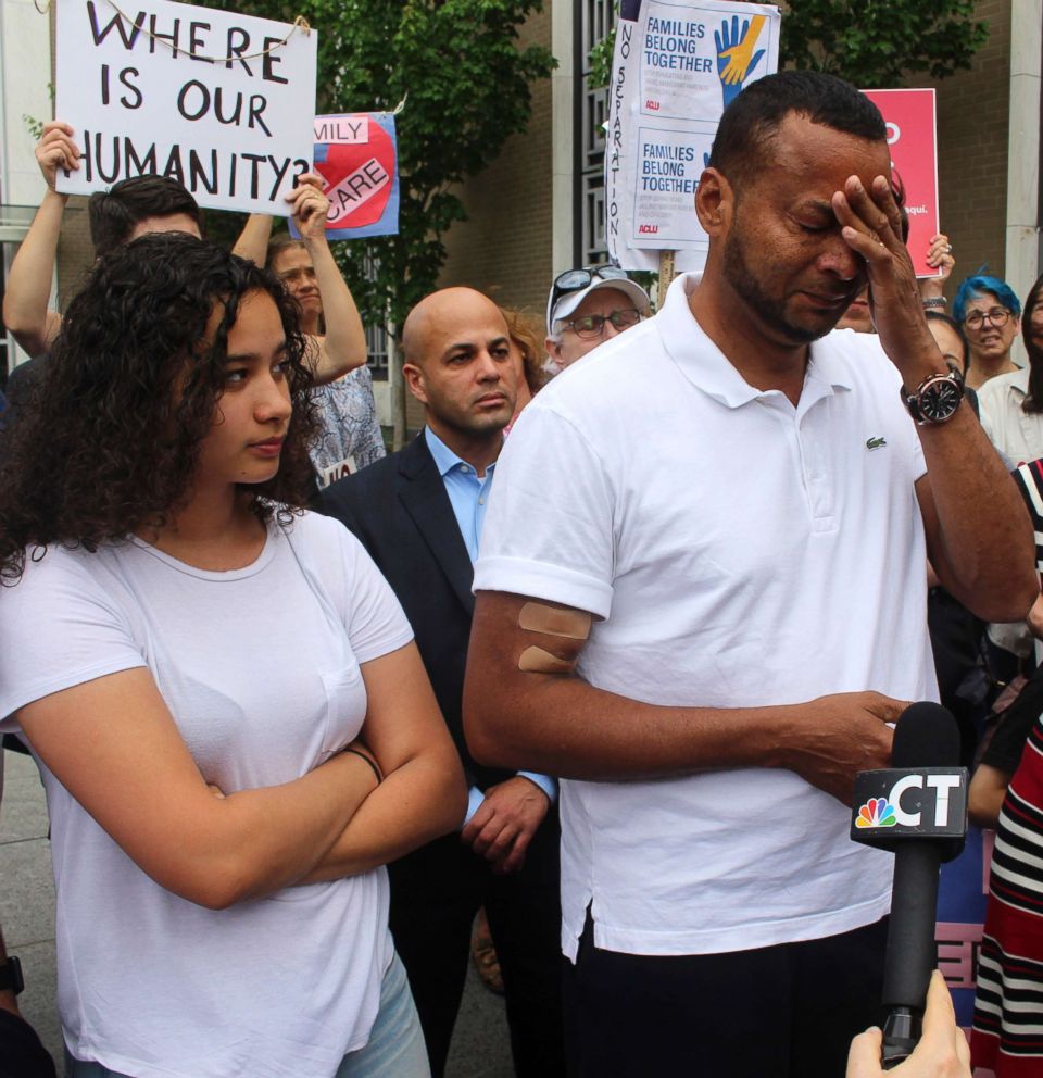 PHOTO: Nelson Rosales Santos, 49, an immigrant who lives in Stamford, Conn., talks to reporters while standing next to his 14-year-old daughter, Samantha, during a rally outside the federal bridling in Hartford, Conn., June 14, 2018.