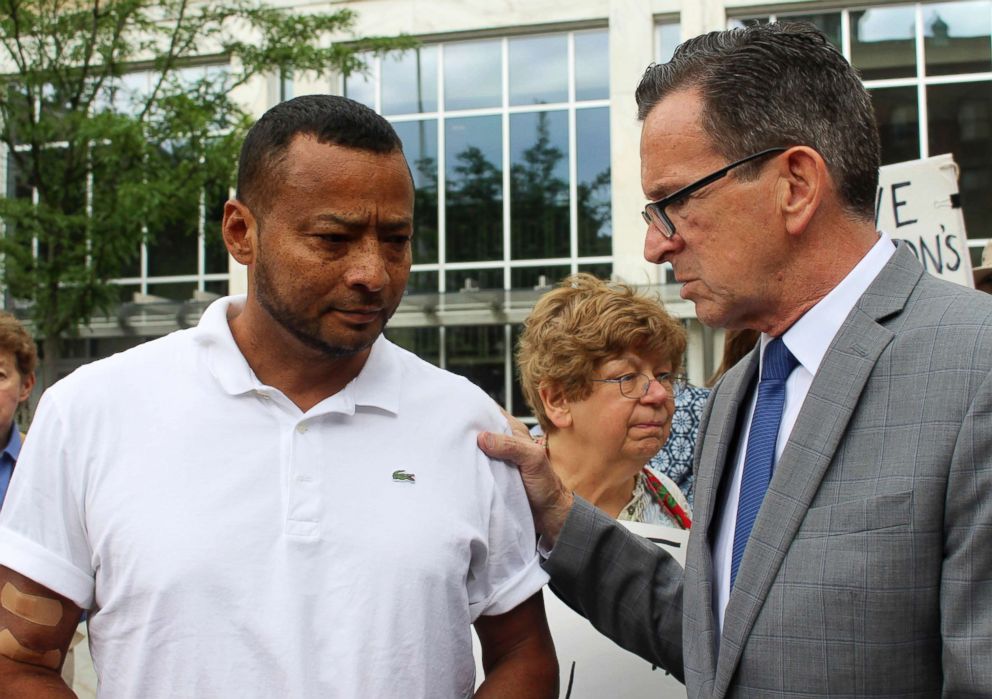 PHOTO: Nelson Rosales Santos, 49, an immigrant who lives in Stamford, Conn., speaks with Connecticut Gov. Dannel P. Malloy before a rally outside the federal bridling in Hartford, Conn., June 14, 2018.