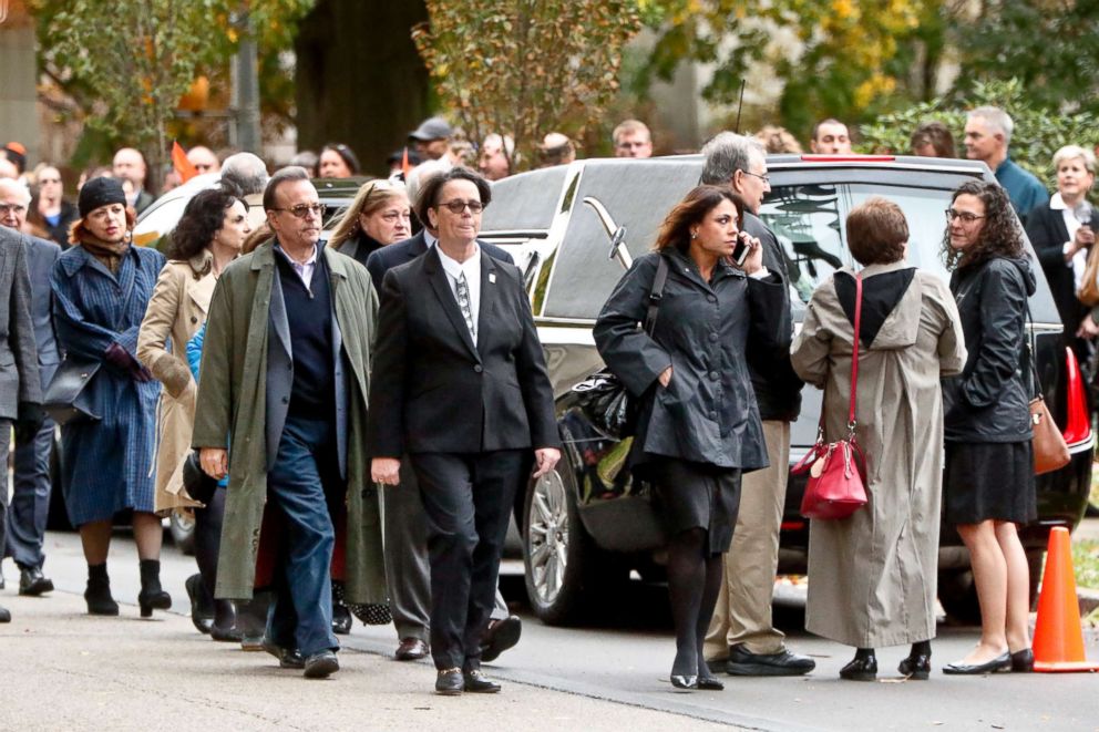 PHOTO: Visitors walk past the hearse as they gather for the funeral of Rose Mallinger, 97, at Congregation Rodef Shalom, Nov. 2, 2018, in Pittsburgh.