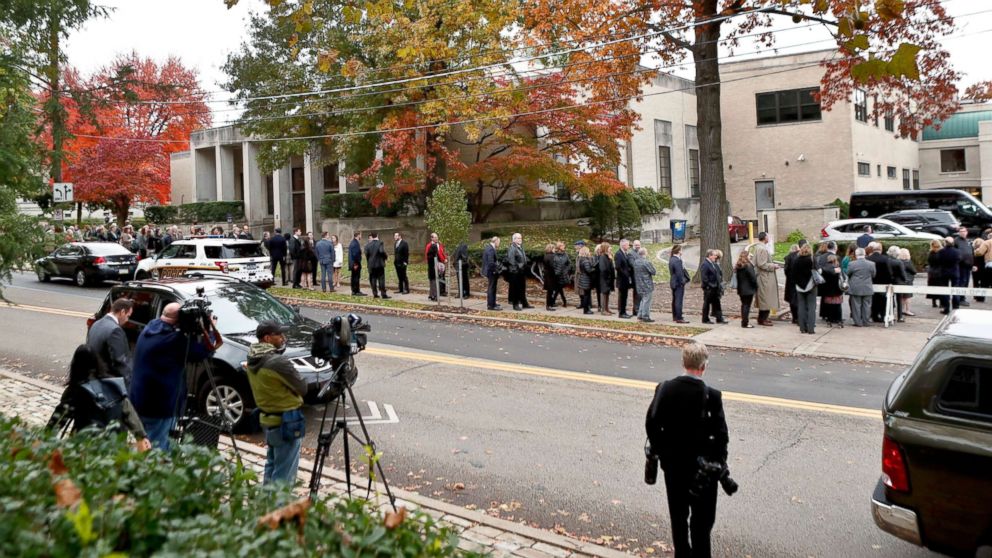 PHOTO: Camera crews record the hundreds of visitors gathering for the funeral of Rose Mallinger, 97, at Congregation Rodef Shalom, Nov. 2, 2018, in Pittsburgh.