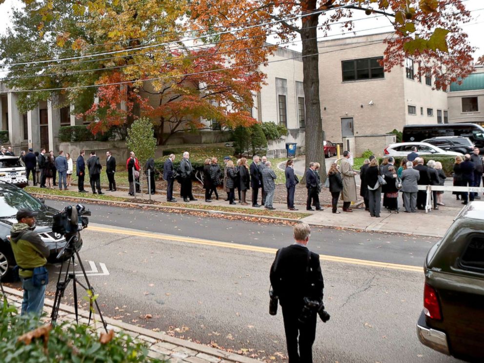PHOTO: Camera crews record the hundreds of visitors gathering for the funeral of Rose Mallinger, 97, at Congregation Rodef Shalom, Nov. 2, 2018, in Pittsburgh.