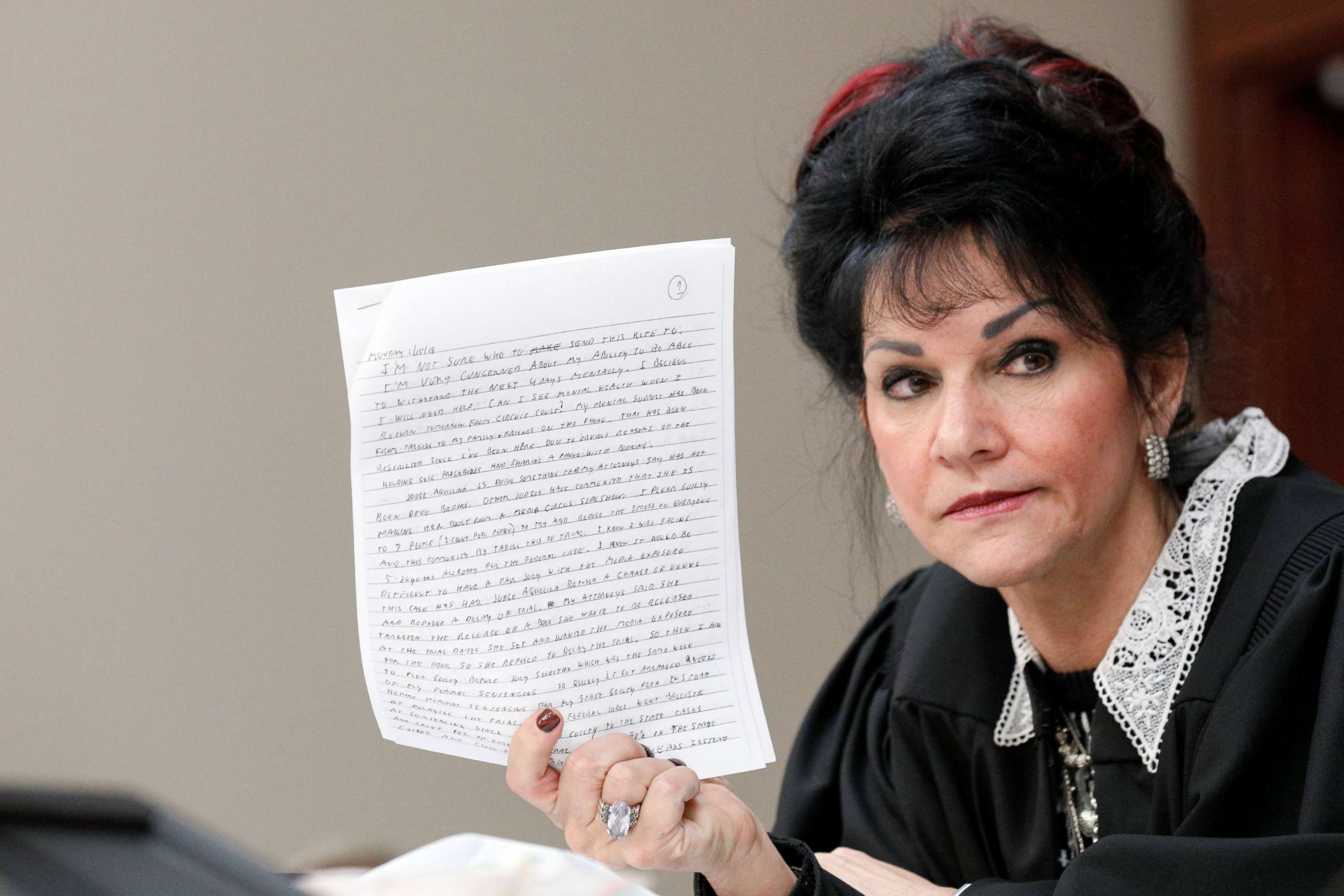PHOTO: Judge Rosemarie Aquilina holds a letter written by Larry Nassar, a former team USA Gymnastics doctor, who pleaded guilty in November 2017 to sexual assault charges, during his sentencing hearing in Lansing, Mich., Jan. 18, 2018. 