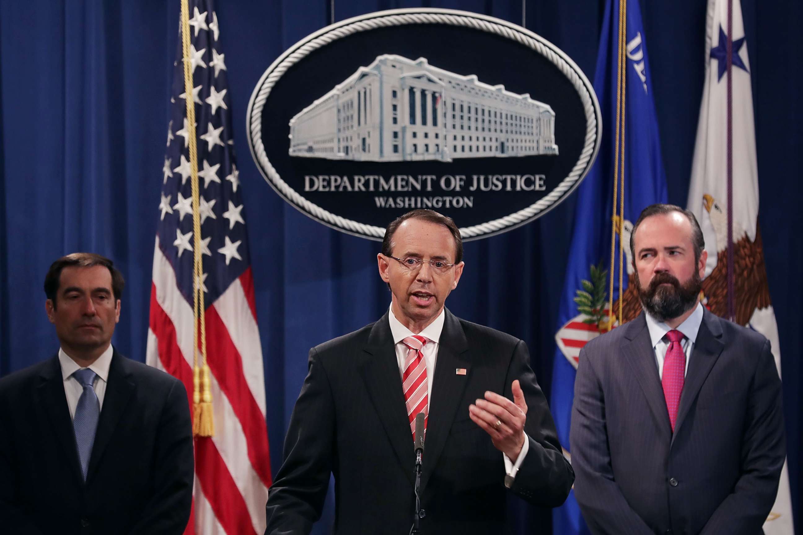 PHOTO: U.S. Deputy Attorney General Rod Rosenstein, center, holds a news conference at the Department of Justice, July 13, 2018, in Washington.