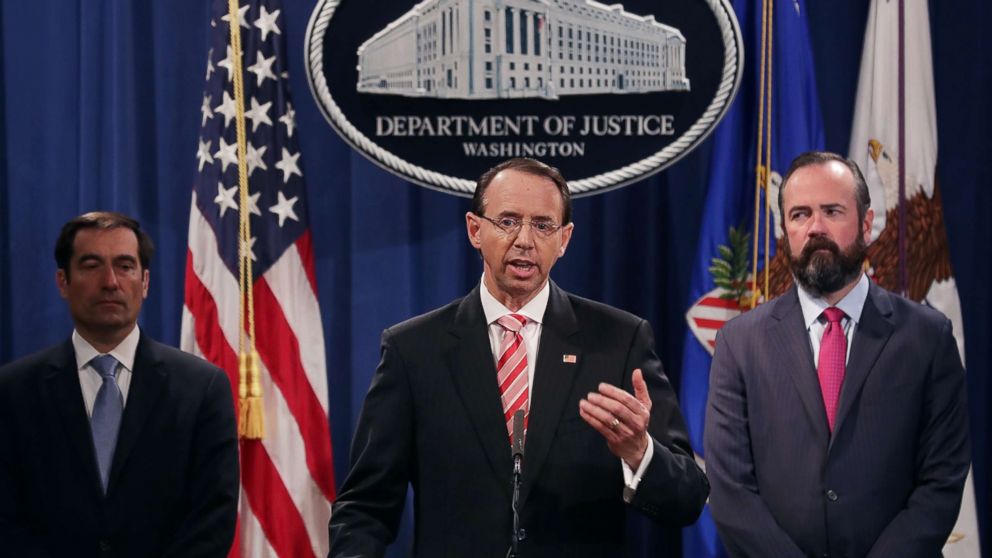 PHOTO: U.S. Deputy Attorney General Rod Rosenstein, center, holds a news conference at the Department of Justice, July 13, 2018, in Washington.