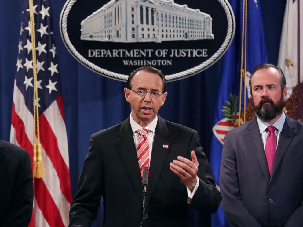 PHOTO: U.S. Deputy Attorney General Rod Rosenstein, center, holds a news conference at the Department of Justice, July 13, 2018, in Washington.