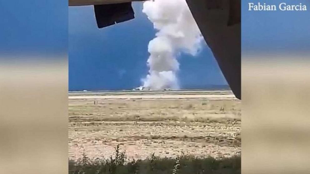 PHOTO: A towering plume of smoke rises from the Roswell Industrial Air Center in Roswell, N.M., on Wednesday, June 5, 2019. Two firefighters were critically injured in a fireworks accident.