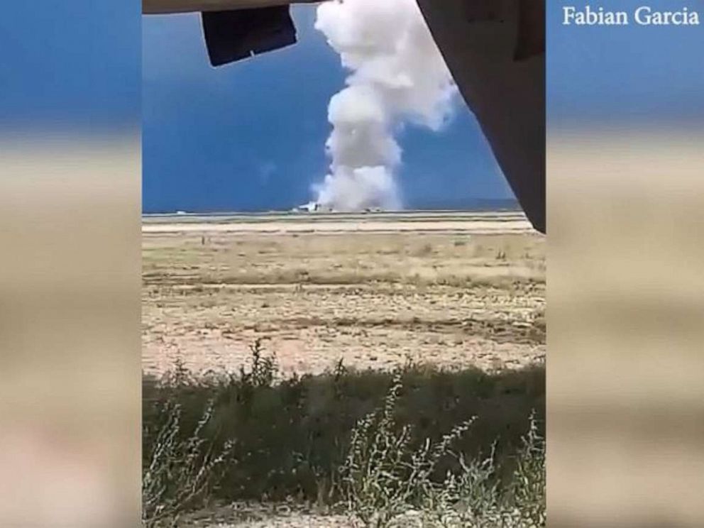 PHOTO: A towering plume of smoke rises from the Roswell Industrial Air Center in Roswell, N.M., on Wednesday, June 5, 2019. Two firefighters were critically injured in a fireworks accident.