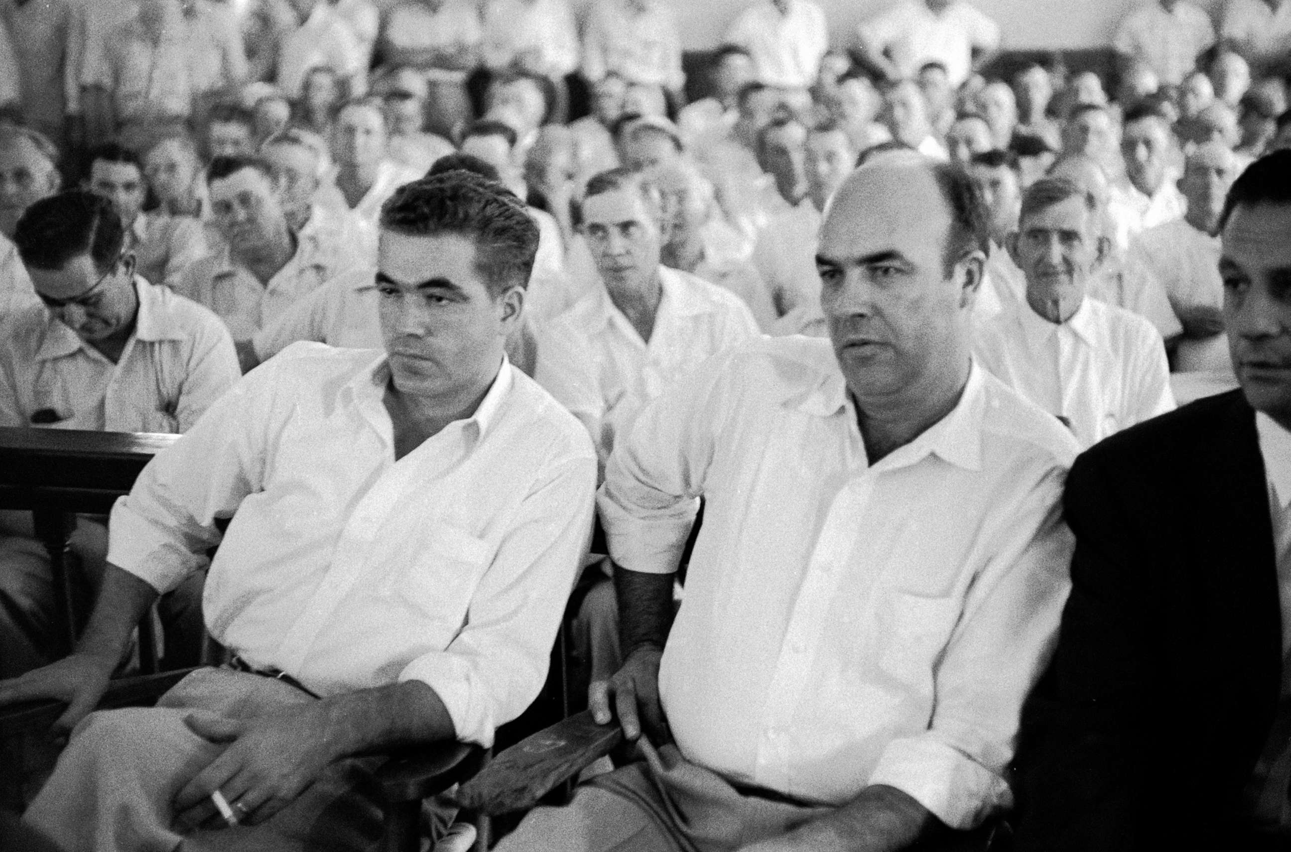 PHOTO: Pictured (L-R), defendants Roy Bryant (1931 - 1994) and J. W. Milam (1919 - 1981) listen to testimony during their murder trial in the packed Tallahatchie County Courthouse in Sumner, Miss., Sept. 1955.