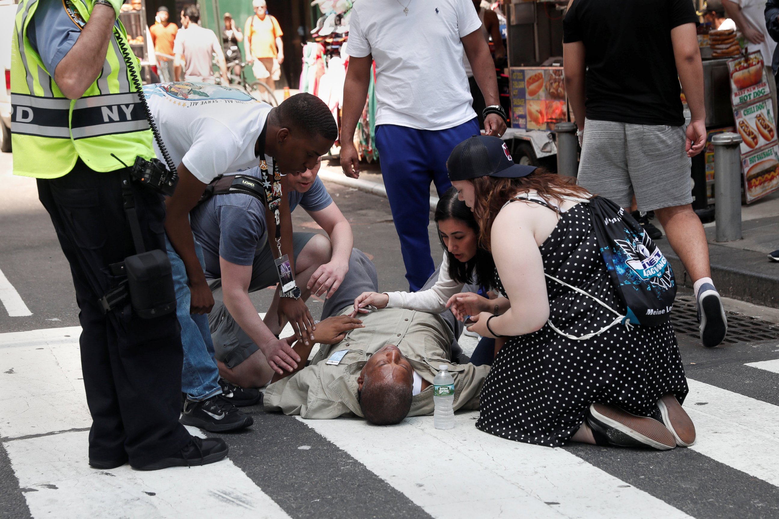 PHOTO: An injured man is helped on the sidewalk in Times Square after a speeding vehicle struck pedestrians on the sidewalk in New York City, May 18, 2017.