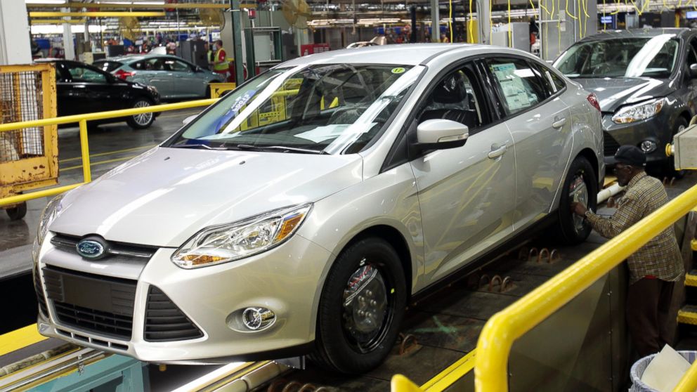PHOTO: A Ford Motor assembly worker works on the final production line of the 2012 Ford Focus at Michigan Assembly Plant in Wayne, Michigan on March 17, 2011.